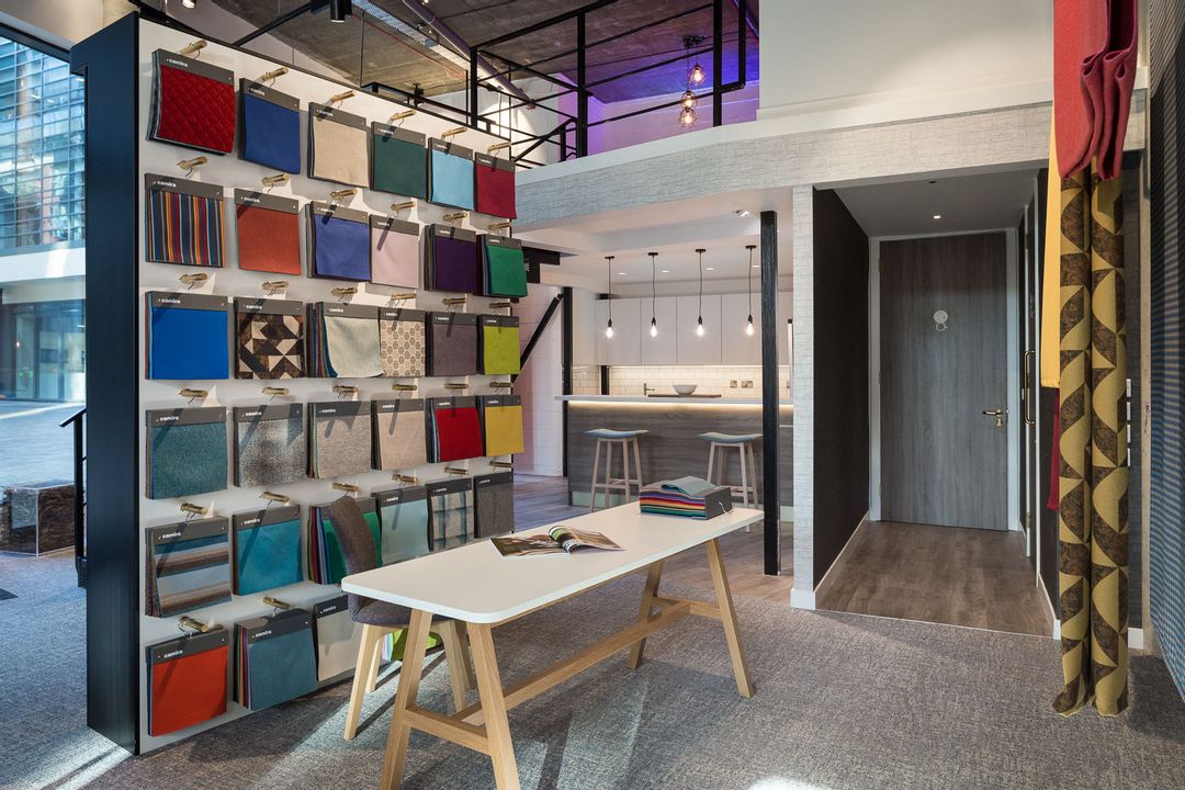 The Fabric swatch wall in Camira's showroom in
                        Clerkenwell