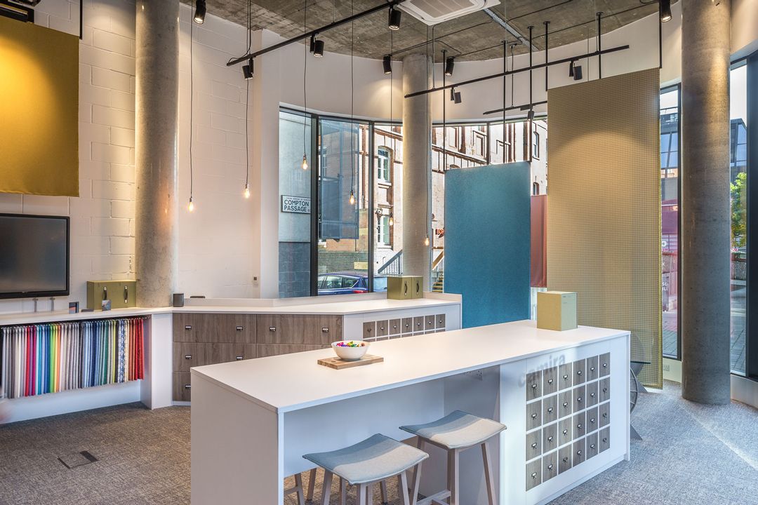Island, reception and lighting rig in Camira's new
                        Showroom in Clerkenwell