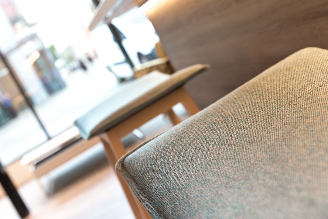 Close up of Camira Fabric upholstered stools