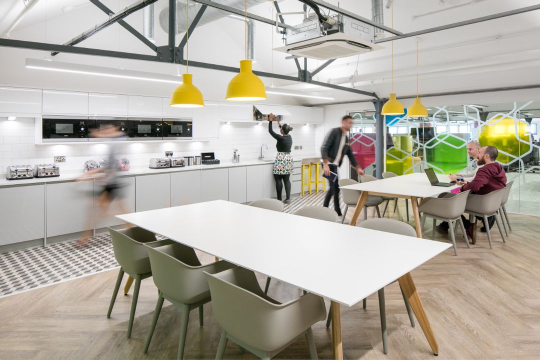 Car Finance 247 - 6th Floor Kitchen Dining Space
                    showing Sven Ligni Tables with Oak Legs and white tops
                    complete with Muuto's Fiber and Visu Chairs and lit by
                    Muuto's Unfold Pendant Lamps in Yellow.