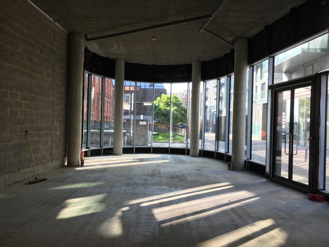 Photo showing the original concrete space looking out towards the front of the building