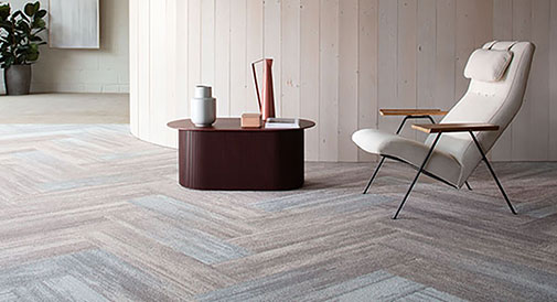 Milliken Colour Compositions - shows carpet planks in grey
                and colour layout in a modern minimalistic house setting.