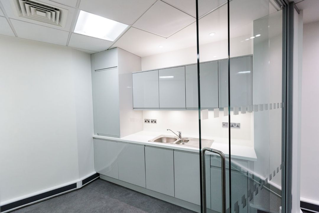 Sliding glass partition door leading on to separated
                    kitchenette at the Primary Capital Manchester Offices